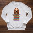 Cute Basset Hound Dog Reading On Pile Of Books Raglan Sleeve Sweatshirt Heather Mustard