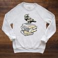 Dark Academia Aesthetic Raven Crow On Old Vintage Books Raglan Sleeve Sweatshirt Heather Mustard