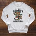 EASILY DISTRACTED BY DRAGONS & BOOKS Medieval Fantasy Reader Raglan Sleeve Sweatshirt Heather Mustard