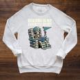 Football Skeleton Reading On Book Stack Raglan Sleeve Sweatshirt Heather Mustard