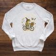 On My Way To Hoard Books And Cause Chaos Tom Foolery Frog Raglan Sleeve Sweatshirt Heather Mustard