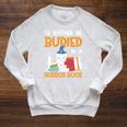 I’d Rather Be Buried In A Horror Book Spooky Skull Book Fan Raglan Sleeve Sweatshirt Heather Mustard