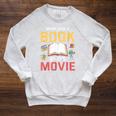 Never Judge A Book By It's Movie Reading Raglan Sleeve Sweatshirt Heather Mustard