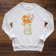 Kawaii Octopus Bookworm Fun Reading Tee For Book Lovers Premium Tri-Blend Raglan Sleeve Sweatshirt Heather Mustard