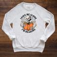 Leave Me Alone I'm Reading Skeleton Reading Book Bookish Raglan Sleeve Sweatshirt Heather Mustard