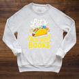 Let's Taco About Books Mexican Pun Bookworm Premium Tri-Blend Raglan Sleeve Sweatshirt Heather Mustard