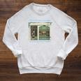 I Live In Two Worlds One Is A World Of Books Raglan Sleeve Sweatshirt Heather Mustard I Live In Two Worlds One Is A World Of Books Raglan Sleeve Sweatshirt Heather Mustard