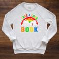 Take A Look It's In A Book Retro Groovy Reading Books Lovers Raglan Sleeve Sweatshirt Heather Mustard Take A Look It's In A Book Retro Groovy Reading Books Lovers Raglan Sleeve Sweatshirt Heather Mustard