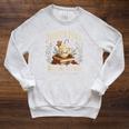 North Pole Book Club Christmas Reading Hot Cocoa Graphic Raglan Sleeve Sweatshirt Heather Mustard