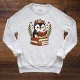 Penguin Reading Book Graphic Penguin With Book Floral Raglan Sleeve Sweatshirt Heather Mustard