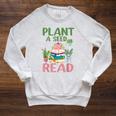 Plant A Seed Read Reading Summer 2026 Teacher Librarian Book Raglan Sleeve Sweatshirt Heather Mustard