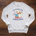I Still Read Children’s Books Cute Duck Reading Book Lover Raglan Sleeve Sweatshirt Heather Mustard