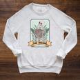 The Reader Tarot Card Skeleton With Book Lover Bookworm Raglan Sleeve Sweatshirt Heather Mustard The Reader Tarot Card Skeleton With Book Lover Bookworm Raglan Sleeve Sweatshirt Heather Mustard