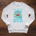 Reading Books Easily Distracted By Dragons And Books Raglan Sleeve Sweatshirt Heather Mustard