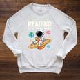 Reading Is Out Of This World Cute Astronaut Books Lover Raglan Sleeve Sweatshirt Heather Mustard Reading Is Out Of This World Cute Astronaut Books Lover Raglan Sleeve Sweatshirt Heather Mustard