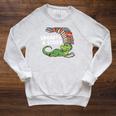 Summer Reading 2026 Unearth a Story Theme Dinosaur Book Nerd Raglan Sleeve Sweatshirt Heather Mustard