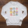 Summer Reading 2026 Unearth A Story Dinosaur Books Readers Raglan Sleeve Sweatshirt Heather Mustard Summer Reading 2026 Unearth A Story Dinosaur Books Readers Raglan Sleeve Sweatshirt Heather Mustard