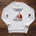 Never Underestimate A Woman Who Still Reads Books In Her Raglan Sleeve Sweatshirt Heather Mustard