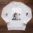 Unearth A Story Astronaut Finds Book On The Moon Raglan Sleeve Sweatshirt Heather Mustard