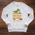 Unearth a Story Dinosaur Reading Books Summer 2026 Raglan Sleeve Sweatshirt Heather Mustard