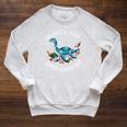Unearth A Story Summer Reading 2026 Cute Plesiosaurus Book Raglan Sleeve Sweatshirt Heather Mustard