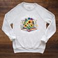 Unearth A Story Summer Reading 2026 Flower Butterfly Book Premium Tri-Blend Raglan Sleeve Sweatshirt Heather Mustard