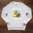 Unearth a Story Triceratops Dinosaur Reading Books Cute Dino Premium Tri-Blend Raglan Sleeve Sweatshirt Heather Mustard