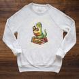Unreath a Story Summer Library Reading 2026 Dinosaur Book Raglan Sleeve Sweatshirt Heather Mustard