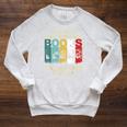 Some Of Us Grew Up Reading Books The Cool Ones Still Do Raglan Sleeve Sweatshirt Heather Mustard