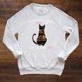 A Woman Cannot Survive On Books Alone She Also Needs CAT Raglan Sleeve Sweatshirt Heather Mustard