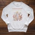 Women's Dungeon Crawler Carl The Inevitable Ruin Cover LitRPG Book Raglan Sleeve Sweatshirt Heather Mustard Women's Dungeon Crawler Carl The Inevitable Ruin Cover LitRPG Book Raglan Sleeve Sweatshirt Heather Mustard