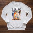 Women's Unearth A Story Rainbow Treasure Book Summer Reading 2026 Raglan Sleeve Sweatshirt Heather Mustard Women's Unearth A Story Rainbow Treasure Book Summer Reading 2026 Raglan Sleeve Sweatshirt Heather Mustard
