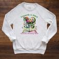 Women's Unearth A Story Summer Reading 2026 Dinosaur Book Floral Raglan Sleeve Sweatshirt Heather Mustard