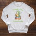 Women's Unearth a Story Triceratops Dinosaur Reading Books Cute Dino Raglan Sleeve Sweatshirt Heather Mustard