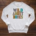 Women's Wild About Books Reading Animal Book Lover Teacher Raglan Sleeve Sweatshirt Heather Mustard