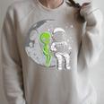 Astronaut Reading Book To Alien Moon Space Women Kids Men Premium Tri-Blend Raglan Sleeve Sweatshirt Heather Forest