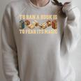 To Ban A Book Is To Fear Its Magic Men Women Raglan Sleeve Sweatshirt Heather Forest