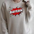 Bayern Comic Book Style Splash Raglan Sleeve Sweatshirt Heather Forest Bayern Comic Book Style Splash Raglan Sleeve Sweatshirt Heather Forest