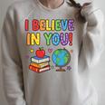 I Believe In You Educational Art With Books And Globe Raglan Sleeve Sweatshirt Heather Forest