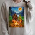 Bigfoot And Alien Reading Books Campfire Halloween Raglan Sleeve Sweatshirt Heather Forest