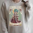 A Book a Day Keeps Reality Away Fairy Reading Tarot Card Raglan Sleeve Sweatshirt Heather Forest A Book a Day Keeps Reality Away Fairy Reading Tarot Card Raglan Sleeve Sweatshirt Heather Forest