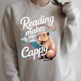 Book Lover Reading Makes Me Cappy Pun Capybara Reading Raglan Sleeve Sweatshirt Heather Forest