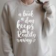 Book Reading A Book A Day Keeps Reality Away Raglan Sleeve Sweatshirt Heather Forest