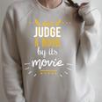 Booklovers Don't Judge A Book By Its Movie Raglan Sleeve Sweatshirt Heather Forest