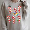 Bookmas Christmas Books Shirt Candy Cane Bookworm Raglan Sleeve Sweatshirt Heather Forest