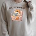 BOOKTROVERT Cute Cat With Tea Cozy Sweater And Book Raglan Sleeve Sweatshirt Heather Forest BOOKTROVERT Cute Cat With Tea Cozy Sweater And Book Raglan Sleeve Sweatshirt Heather Forest