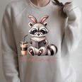 Booktrovert Raccoon Reading Book Iced Coffee Lover Raglan Sleeve Sweatshirt Heather Forest