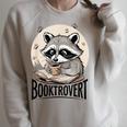 Booktrovert Raccoon Reading And Coffee For Book Lover Raglan Sleeve Sweatshirt Heather Forest Booktrovert Raccoon Reading And Coffee For Book Lover Raglan Sleeve Sweatshirt Heather Forest