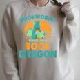 Bookworm Kids Dragon Lover Book Reader Fun Raglan Sleeve Sweatshirt Heather Forest Bookworm Kids Dragon Lover Book Reader Fun Raglan Sleeve Sweatshirt Heather Forest