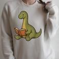 Brachiosaurus Dinosaur Reading Book Nerd Raglan Sleeve Sweatshirt Heather Forest